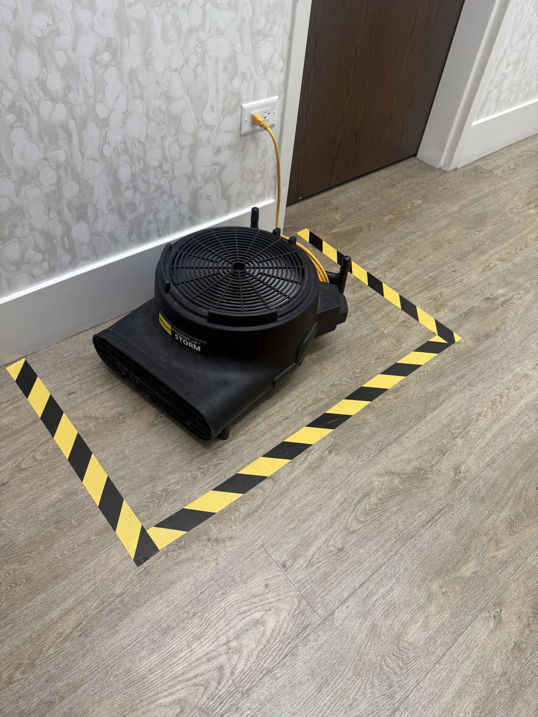 Clean Pushers floor care with a taped-off safety zone on a Chicago commercial floor